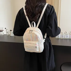 White mini backpack for women with colorful embroidery and quilted texture in casual style