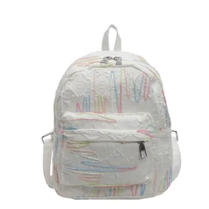 Minimalist white backpack with colorful wave embroidery and dual metal zippers for students