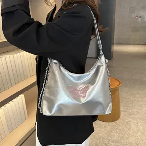 Silver hobo bag with pink butterfly embroidery and metallic dual shoulder chains