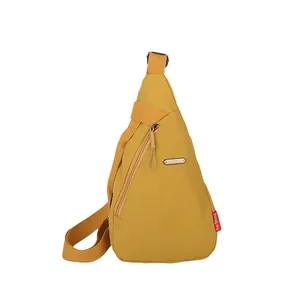Minimalist bright yellow triangle canvas chest bag with adjustable strap and metal plaque
