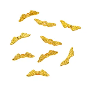 Polished gold wing spacer beads for DIY jewelry making with intricate feather details