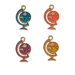 Detail of four colorful enamel globe alloy charms for DIY jewelry making and keychains
