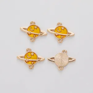 Set of four celestial planet alloy charms with gold plating and yellow enamel finish
