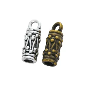 Vintage alloy bead pendants in antique silver and bronze with carved tribal patterns