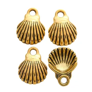 Set of four vintage gold seashell alloy pendants for DIY jewelry making accessories