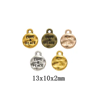 Ciondoli in Lega Rotondi Love Peace Incisi per Creazione Gioielli DIY Pendenti in Metallo Retro Vintage Accessori per Artigianato