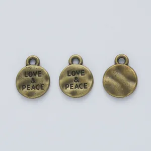 Ciondoli rotondi in bronzo vintage Love & Peace per creazione di gioielli fai-da-te
