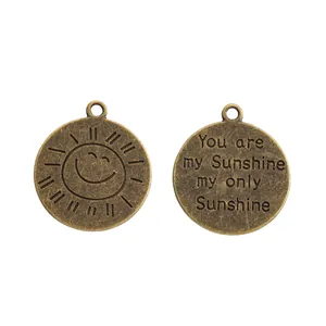 Vintage bronze sun charm with You Are My Sunshine engraving for DIY jewelry making