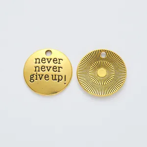 Vintage gold zinc alloy round charm with engraved 'never never give up!' motivational text