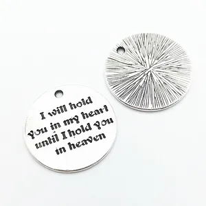 Round silver DIY charm with engraved heart message and textured back for jewelry making