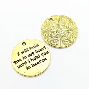 Golden round memorial heart pendant charm with engraved sentimental text and radial texture