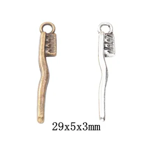 Vintage alloy toothbrush charms set in bronze and silver finishes, size 29x5x3mm