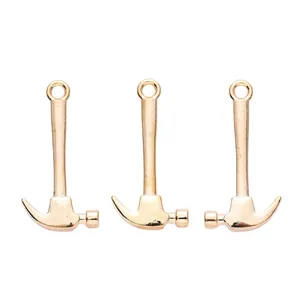 Set of three gold claw hammer charms made of polished alloy for DIY jewelry and crafts
