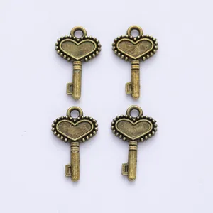 Set of four vintage bronze alloy heart-shaped key charms for DIY jewelry making