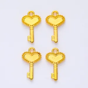 Macro view of vintage gold alloy heart-shaped crown key pendants for DIY jewelry making