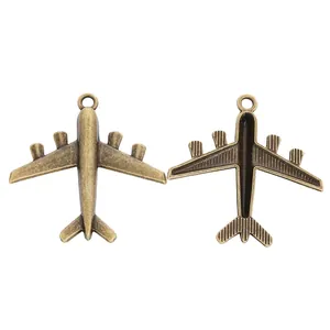 Colgantes de avión vintage color bronce para creación de joyas DIY y llaveros