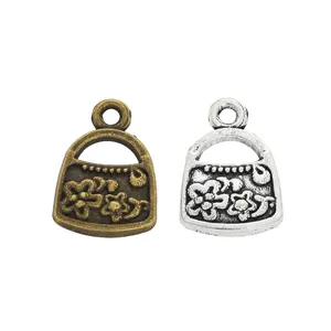 Colgantes de mini bolso vintage de aleación de zinc con relieve floral para joyas DIY