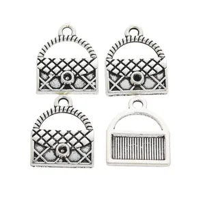 Macro detail of retro zinc alloy handbag charms with quilted texture for DIY jewelry making
