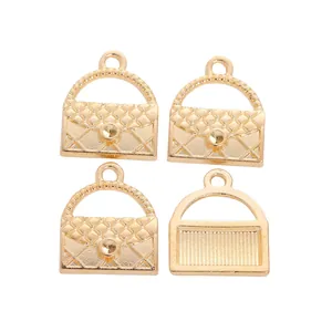 Macro detail of gold handbag charms with quilted texture and textured metal backing