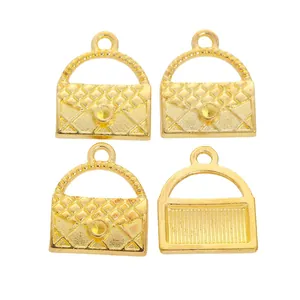 Macro view of gold-plated handbag charms with classic quilted patterns for DIY crafts