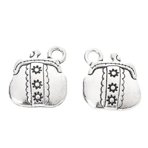 Vintage zinc alloy coin bag pendants with embossed sun flower patterns for DIY jewelry