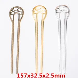 Tre forcine per capelli in metallo con motivo a nuvola traforata in bronzo oro argento