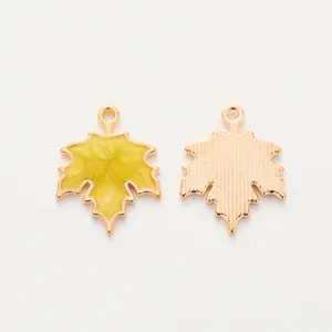 Golden maple leaf alloy pendants with yellow enamel and textured back for DIY jewelry