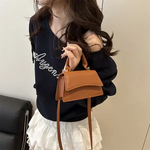 Caramel brown mini leather crossbody bag with top handle and荔枝 texture for daily style