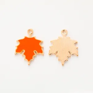 Detailed front and back view of orange maple leaf alloy charms for jewelry DIY