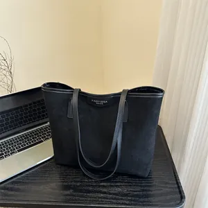 Classic large black tote bag with suede texture and leather details for office work