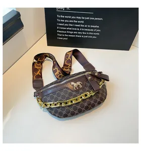Detail view of vintage monogram chest bag with gold horse logo and chain strap