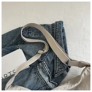 Detail of beige nylon messenger bag with pleated fabric and adjustable strap