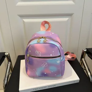 Detail view of purple star gradient mini backpack with flower shaped golden zippers
