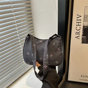 Vintage dark gray denim tote bag with cute pink and green bow patterns and slim straps