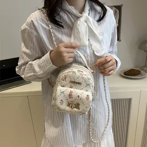 Mini floral bear print crossbody bag with golden chain strap for women in cream white