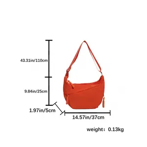 Vibrant orange nylon crescent crossbody bag with size dimensions on white background