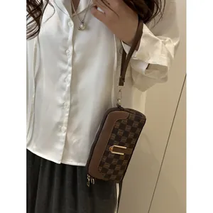 Deep brown checkerboard crossbody bag with horseshoe gold buckle for women fashion look