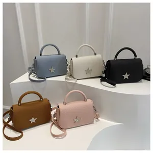 Fashionable crossbody bags with star buckle in blue, white, black, brown, and pink