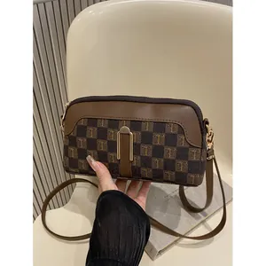 Brown checkered crossbody bag with T-pattern, faux leather texture and metal buckle