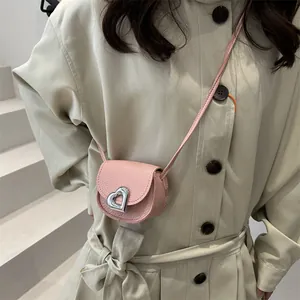 Mini pink heart saddle bag for girls with textured finish and silver buckle