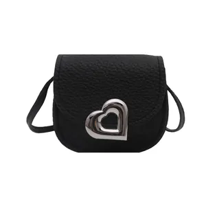 Mini black heart saddle bag for girls with lychee grain texture and silver metal buckle