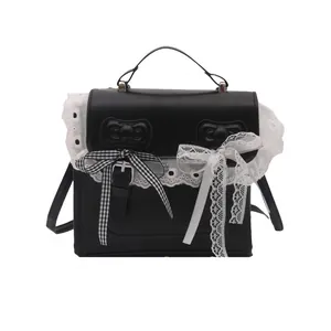 Lace-trimmed black PU leather backpack with sweet butterfly bow accents and top handle
