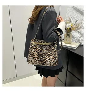 Detail of leopard print tote bag showing thick canvas texture and sturdy double handles