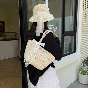 Handmade woven straw tote bag with colorful polka dots and a large white lace bow