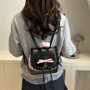 Zaino carino nero e rosa a pois con pizzo, fiocco e ciondolo a cuore per donne