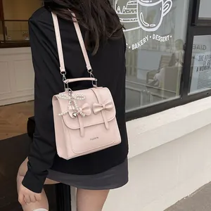 Pink butterfly backpack with heart pearl charm and 'Fashion' text for women
