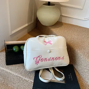 Chic beige PU leather crossbody bag with pink bow embroidery and adjustable strap