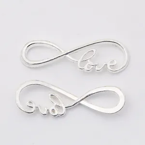 Macro detail of silver vintage infinity LOVE pendants for DIY jewelry making