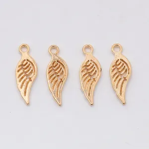 Set of four gold-colored wing charms with feather texture for DIY jewelry making