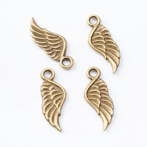 Set di 4 ciondoli a forma di ala in bronzo vintage con piume per creazione gioielli fai-da-te